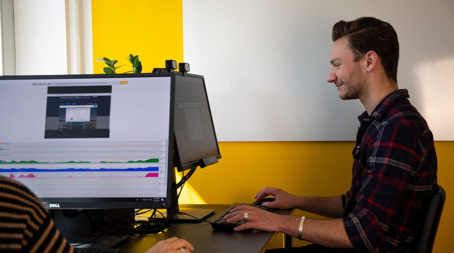 A researcher conducting a human behavior study using multimodal biometric software, analyzing visual attention and engagement on a computer screen