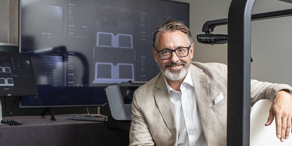 Smart Eye CEO Martin Krantz in a vehicle buck demoing the company's Automotive Interior Sensing software