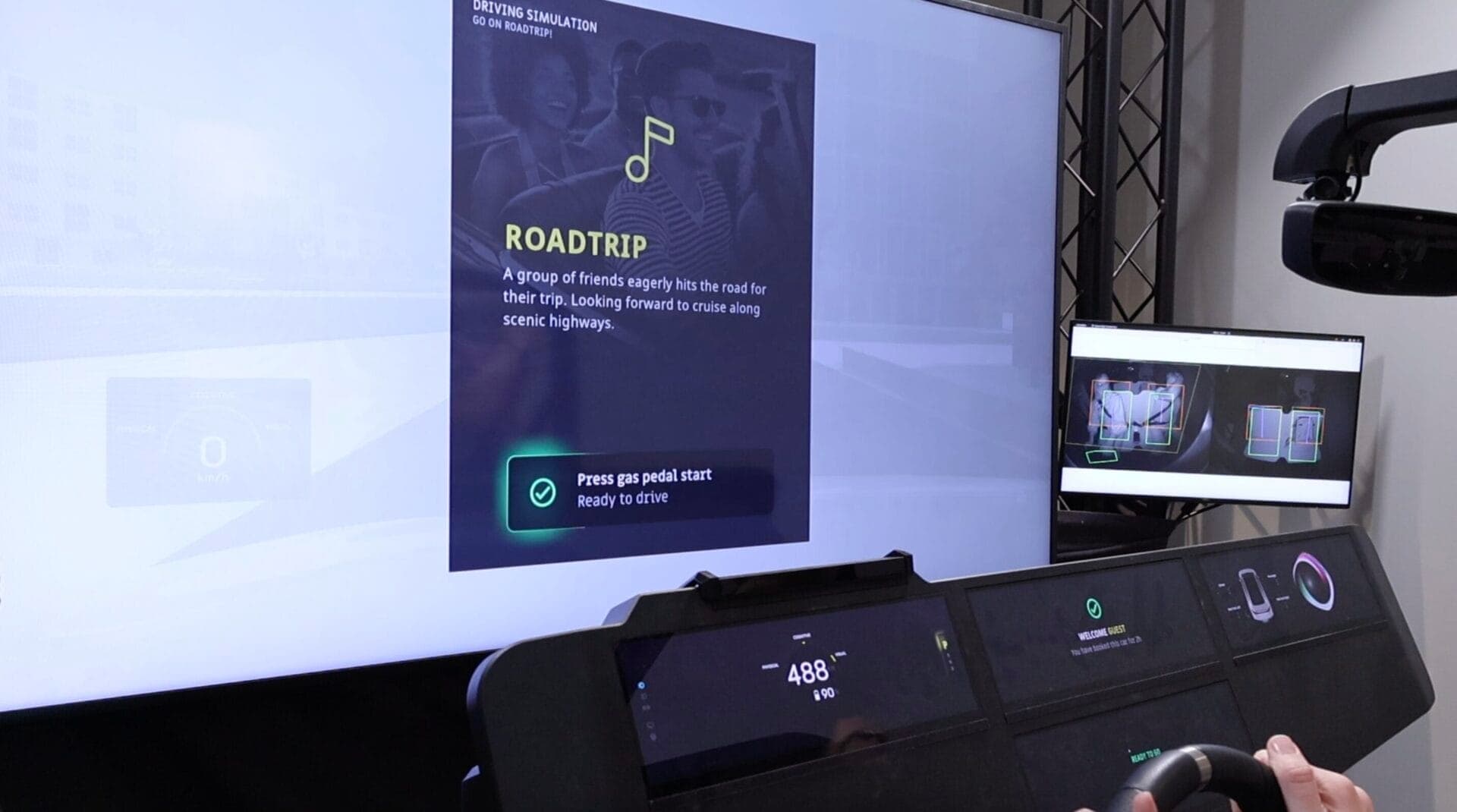 A driving simulation interface showcasing the "Road Trip" scenario with a group of friends embarking on a scenic journey, including prompts to start the drive.